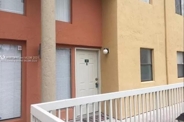 5200 NW 31st Ave Unit 217, Fort Lauderdale, FL 33309 - property entrance featuring stucco siding