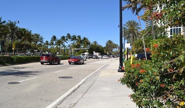 19201 Collins Ave Unit 729, Sunny Isles Beach, FL 33160 - view of asphalt street featuring street lights, curbs, and sidewalks
