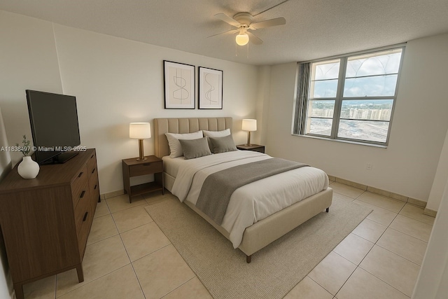 15600 NW 7th Ave Unit 807, Miami, FL 33169 - bedroom featuring light tile patterned floors and ceiling fan