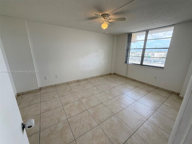 15600 NW 7th Ave Unit 807, Miami, FL 33169 - spare room with ceiling fan, a textured ceiling, and light tile patterned floors