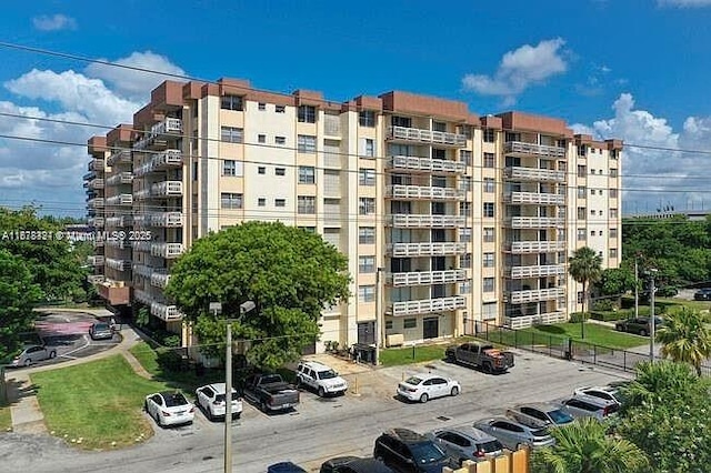 15600 NW 7th Ave Unit 807, Miami, FL 33169 - view of apartment building / complex with uncovered parking