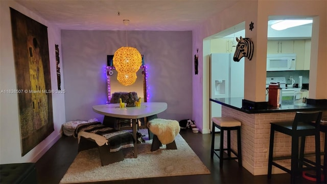 200 NE 12th Ave Unit 7B, Hallandale Beach, FL 33009 - dining area featuring dark wood-style flooring