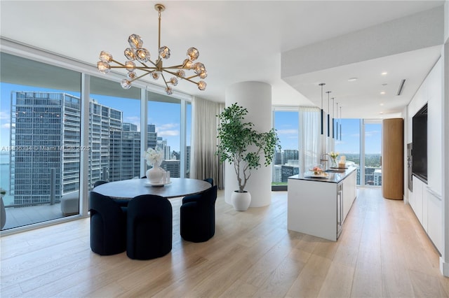 300 Biscayne Blvd Way Unit 4707, Miami, FL 33131 - kitchen featuring a chandelier, light wood-style floors, dark countertops, and expansive windows
