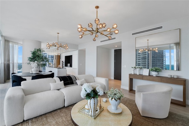 300 Biscayne Blvd Way Unit 4707, Miami, FL 33131 - living room featuring a chandelier, plenty of natural light, and wood finished floors
