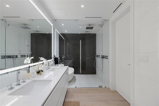 300 Biscayne Blvd Way Unit 4707, Miami, FL 33131 - bathroom with a marble finish shower, double vanity, wood finished floors, and recessed lighting