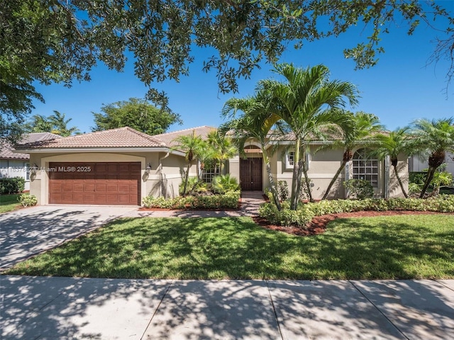 2664 Edgewater Dr, Weston, FL 33332 - view of front of property featuring stucco siding, driveway, an attached garage, a front yard, and a tile roof
