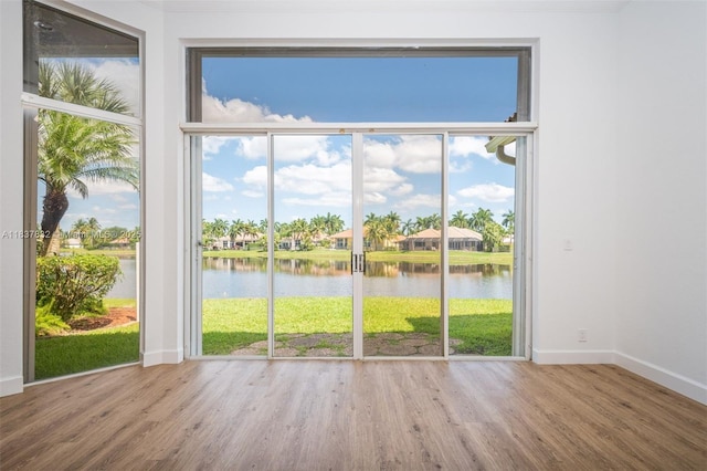 2664 Edgewater Dr, Weston, FL 33332 - entryway with a water view, wood finished floors, and a residential view