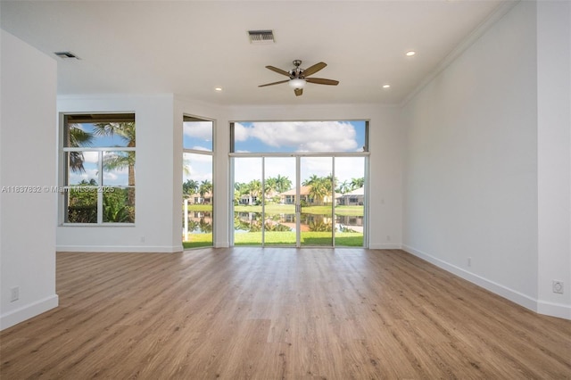 2664 Edgewater Dr, Weston, FL 33332 - spare room featuring plenty of natural light, light wood-style floors, a ceiling fan, crown molding, and recessed lighting