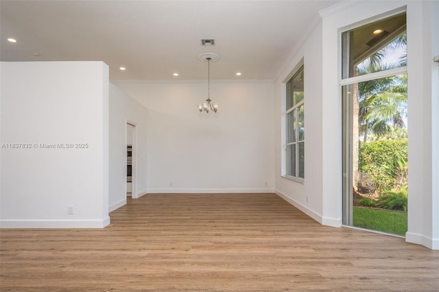 2664 Edgewater Dr, Weston, FL 33332 - unfurnished room featuring plenty of natural light, a chandelier, light wood-style flooring, recessed lighting, and crown molding