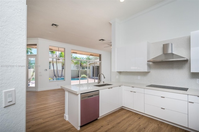 2664 Edgewater Dr, Weston, FL 33332 - kitchen featuring dishwasher, wall chimney range hood, modern cabinets, ornamental molding, and wood finished floors