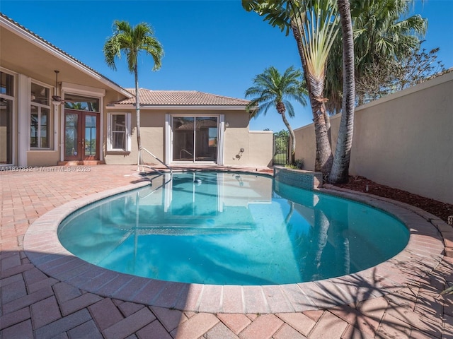 2664 Edgewater Dr, Weston, FL 33332 - view of swimming pool with french doors and a patio area