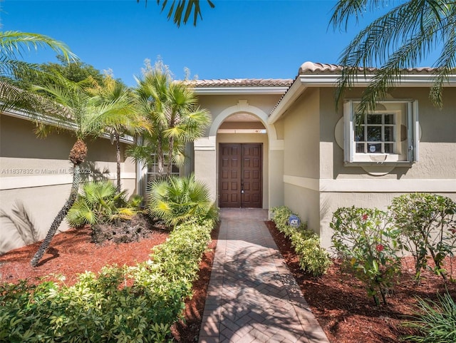 2664 Edgewater Dr, Weston, FL 33332 - entrance to property with stucco siding and a tile roof
