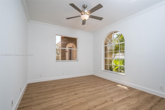 2664 Edgewater Dr, Weston, FL 33332 - spare room featuring crown molding, wood finished floors, and a ceiling fan