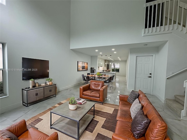 1470 Sweetbay Way, Hollywood, FL 33019 - living room featuring a high ceiling, stairs, light marble finish flooring, and recessed lighting