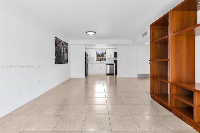 7304 SW 82nd St Unit A107, Miami, FL 33143 - unfurnished room featuring light tile patterned floors and baseboards