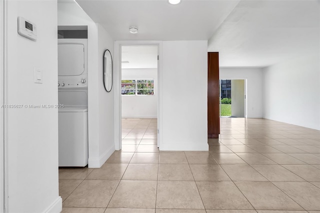 7304 SW 82nd St Unit A107, Miami, FL 33143 - hallway featuring estacked washer and dryer and light tile patterned floors