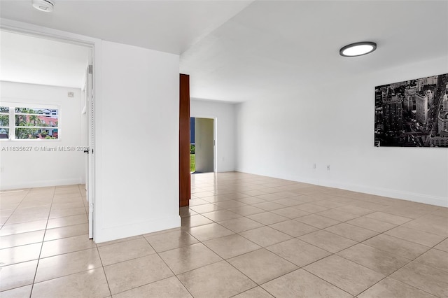 7304 SW 82nd St Unit A107, Miami, FL 33143 - spare room featuring light tile patterned floors and a smoke detector