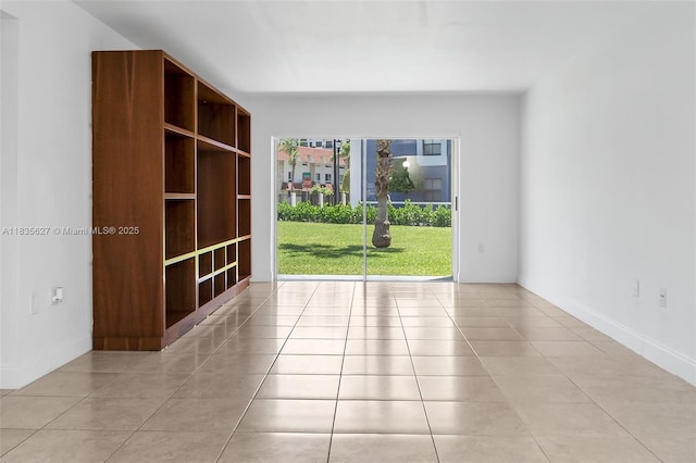 7304 SW 82nd St Unit A107, Miami, FL 33143 - empty room featuring light tile patterned flooring