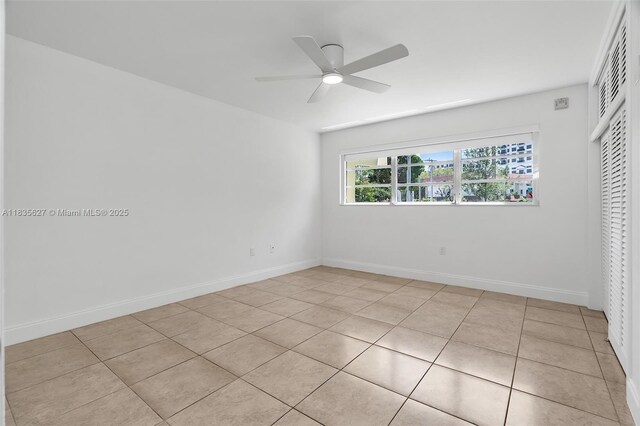 7304 SW 82nd St Unit A107, Miami, FL 33143 - unfurnished bedroom with a closet, light tile patterned floors, and ceiling fan