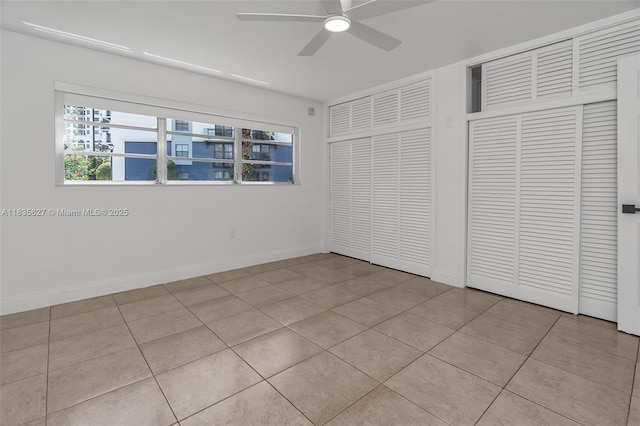 7304 SW 82nd St Unit A107, Miami, FL 33143 - unfurnished bedroom with light tile patterned flooring and ceiling fan