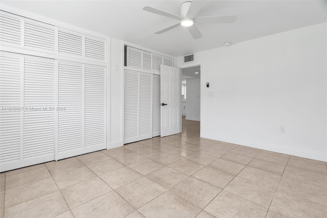 7304 SW 82nd St Unit A107, Miami, FL 33143 - unfurnished bedroom featuring light tile patterned floors and a ceiling fan
