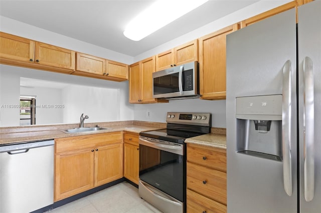 3057 NW 109th Ave Unit 3057, Sunrise, FL 33322 - kitchen featuring stainless steel appliances, light countertops, and light tile patterned floors
