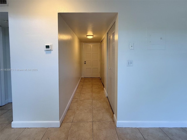 8650 SW 109th Ave Unit 3-112, Miami, FL 33173 - hallway with baseboards and light tile patterned floors