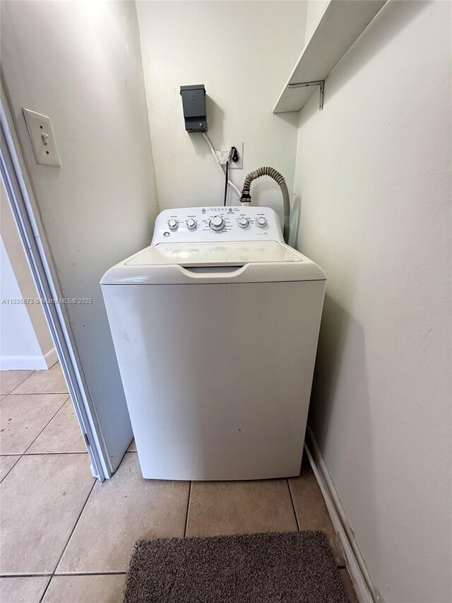8650 SW 109th Ave Unit 3-112, Miami, FL 33173 - washroom with washer / clothes dryer and light tile patterned flooring