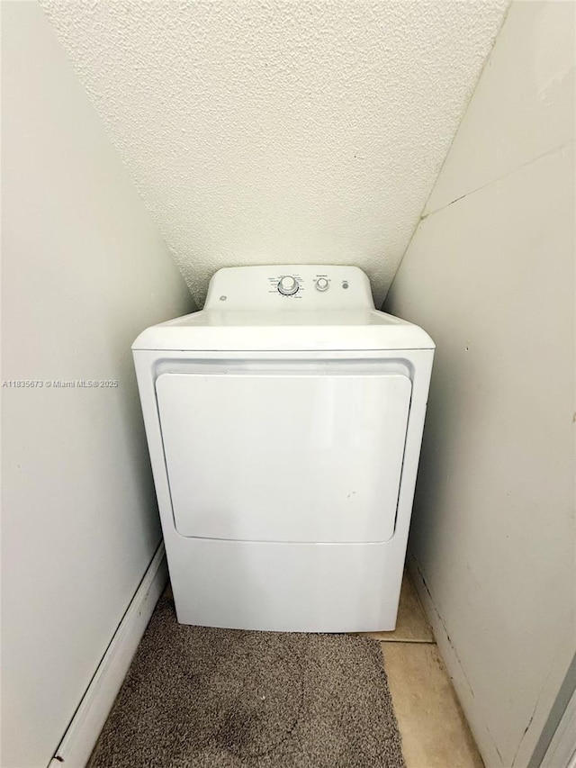 8650 SW 109th Ave Unit 3-112, Miami, FL 33173 - laundry room featuring washer / dryer, a textured ceiling, and light carpet