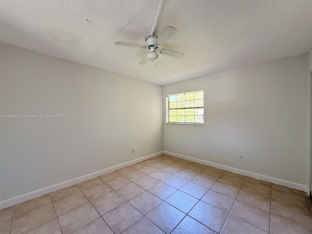 8650 SW 109th Ave Unit 3-112, Miami, FL 33173 - spare room featuring ceiling fan, a textured ceiling, and light tile patterned floors