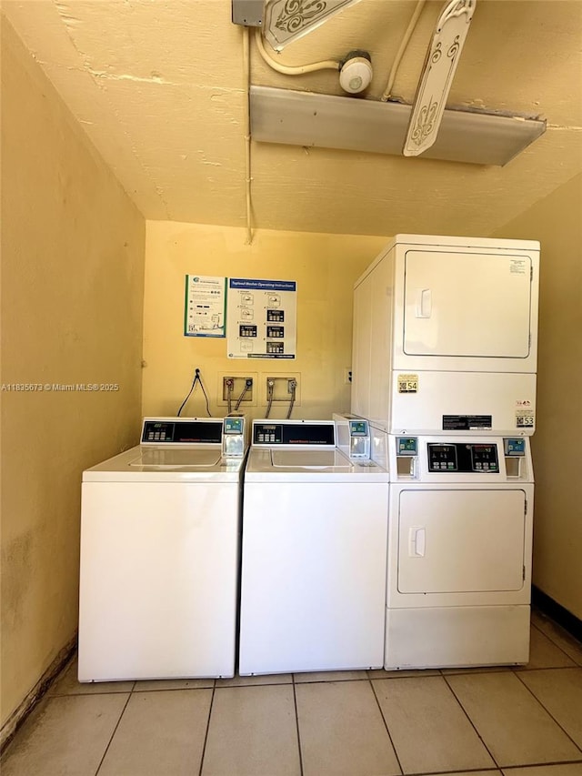 8650 SW 109th Ave Unit 3-112, Miami, FL 33173 - shared laundry featuring stacked washer / dryer, light tile patterned flooring, and independent washer and dryer