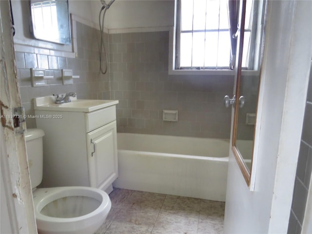 525 NW 16th St, Pompano Beach, FL 33060 - bathroom featuring vanity, bathtub / shower combination, plenty of natural light, and tile patterned flooring