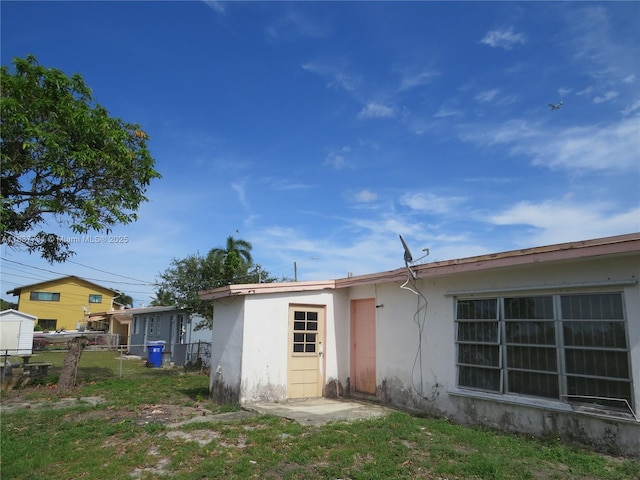 525 NW 16th St, Pompano Beach, FL 33060 - back of property featuring stucco siding