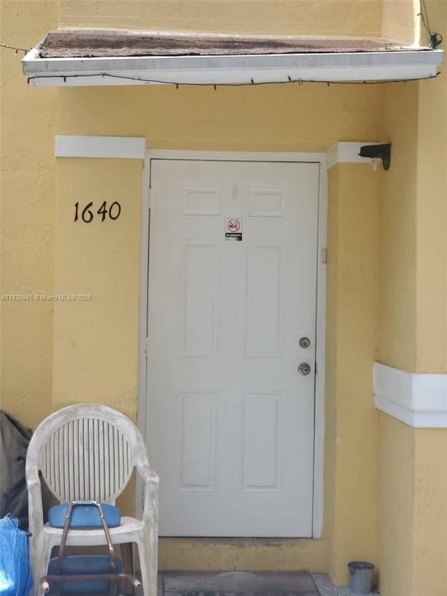 1640 NE 5th St, Homestead, FL 33033 - property entrance featuring stucco siding