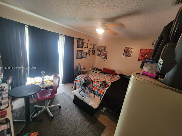 1640 NE 5th St, Homestead, FL 33033 - bedroom featuring a textured ceiling, carpet, and a ceiling fan