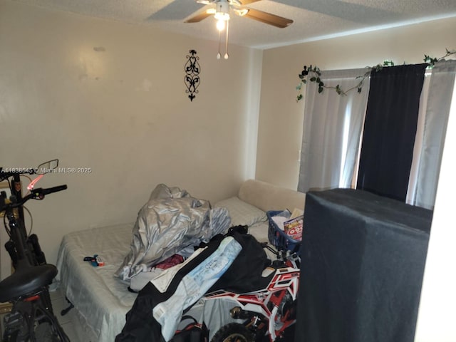 1640 NE 5th St, Homestead, FL 33033 - bedroom featuring ceiling fan and a textured ceiling