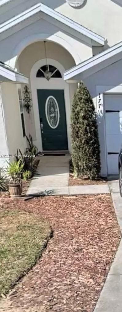 177 Heather Lynn, Davenport, FL 33897 - doorway to property with stucco siding