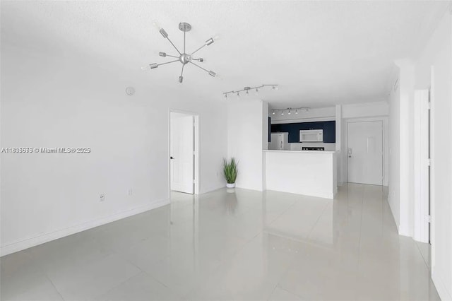 1919 Van Buren St Unit 505A, Hollywood, FL 33020 - unfurnished living room with tile patterned flooring and baseboards