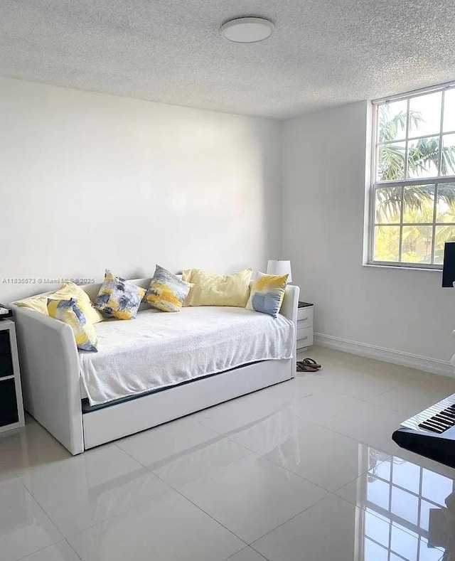 1919 Van Buren St Unit 505A, Hollywood, FL 33020 - bedroom with a textured ceiling and tile patterned flooring