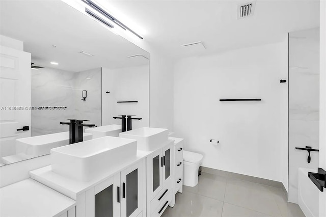 1919 Van Buren St Unit 505A, Hollywood, FL 33020 - bathroom featuring double vanity, a marble finish shower, and tile patterned flooring
