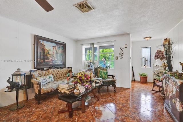 6768 Rose Dr, Miramar, FL 33023 - living room with a textured ceiling and ceiling fan