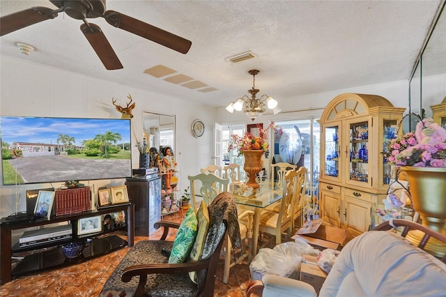 6768 Rose Dr, Miramar, FL 33023 - dining room with a textured ceiling, a chandelier, and ceiling fan