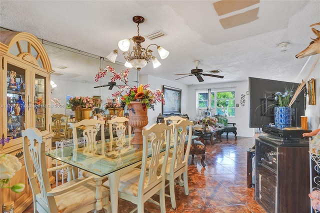 6768 Rose Dr, Miramar, FL 33023 - dining area with a ceiling fan, a chandelier, and a textured ceiling