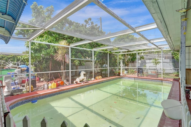 6768 Rose Dr, Miramar, FL 33023 - view of swimming pool featuring a fenced backyard and glass enclosure