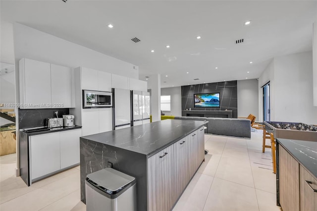 4541 SW 174th Ave, Miramar, FL 33029 - kitchen featuring stainless steel appliances, modern cabinets, white cabinets, a spacious island, and recessed lighting