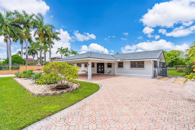 13325 SW 32nd St, Miami, FL 33175 - view of front of property featuring decorative driveway, a tile roof, and stucco siding