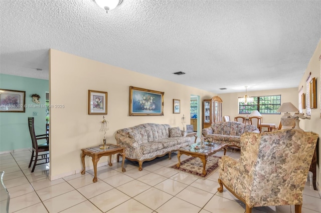 13325 SW 32nd St, Miami, FL 33175 - living room featuring a textured ceiling, a chandelier, and light tile patterned floors