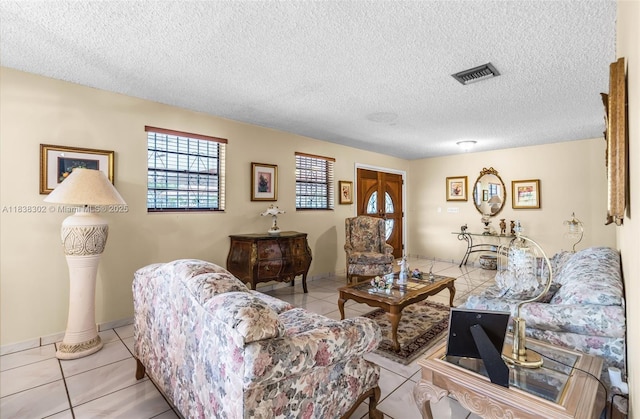 13325 SW 32nd St, Miami, FL 33175 - living room featuring light tile patterned floors and a textured ceiling