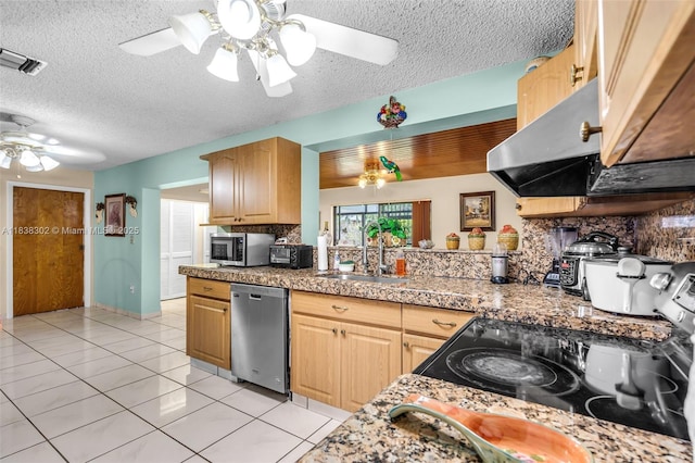 13325 SW 32nd St, Miami, FL 33175 - kitchen featuring appliances with stainless steel finishes, a ceiling fan, light tile patterned floors, a textured ceiling, and backsplash