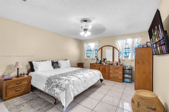 13325 SW 32nd St, Miami, FL 33175 - bedroom with light tile patterned floors, a textured ceiling, and ceiling fan